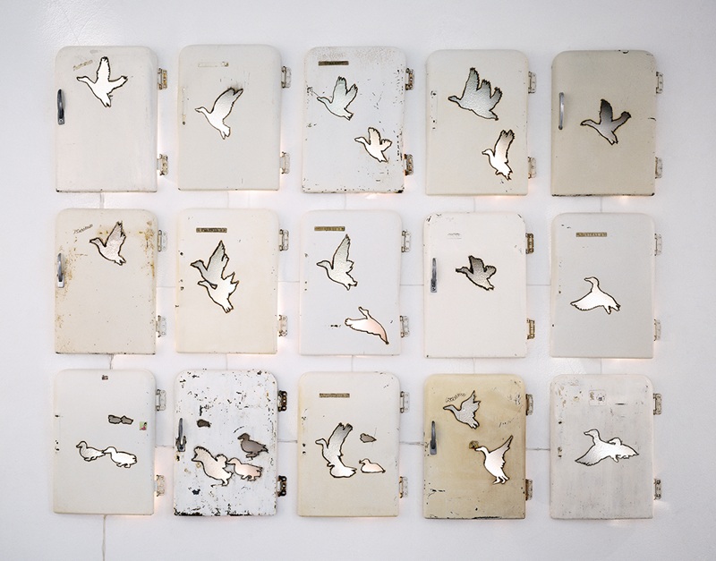 Liz Bachhuber, Ice Birds, 1998, 15 “Kristall” refrigerator doors, cut-out bird silhouettes, programmed wave of light. Liz Bachhuber, Ice Birds, 1998, 15 “Kristall” refrigerator doors, cut-out bird silhouettes, programmed wave of light.