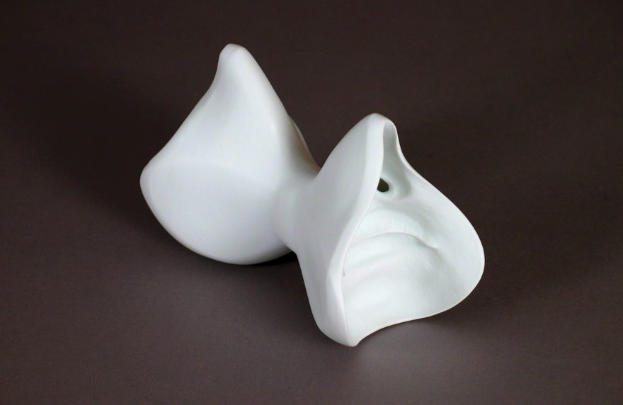 Yevgeniya Kaganovich, double mouth piece 23, 2010. Porcelain, 3¾ by 6 by 3¾ inches each.