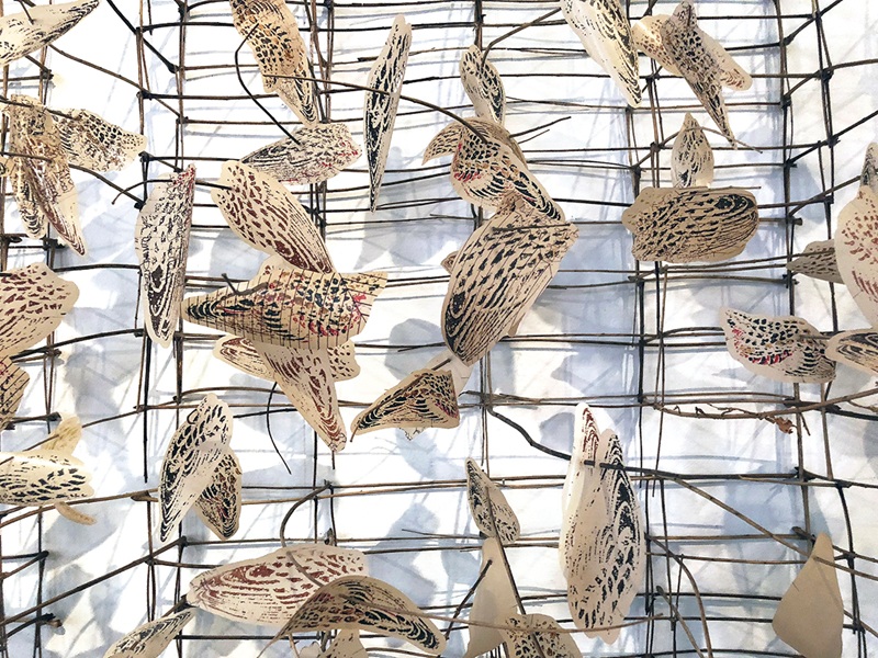 Jill Sebastian, The Limits of Paradise (detail), 2018 Tree of Heaven Sumac stems, laser-cut woodblock print on recycled brown line and mylar. Jill Sebastian, The Limits of Paradise (detail), 2018 Tree of Heaven Sumac stems, laser-cut woodblock print on recycled brown line and mylar.