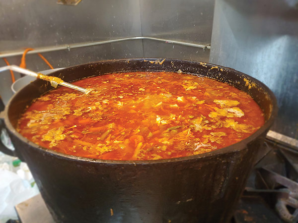 A batch of booyah in a cast iron kettle at the Booyah Shed.
