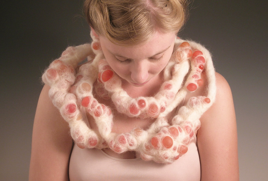 Masako Onodera, Eruption Necklace, 2007. Plastic grapes, wool, brass; 57 by 7 by 4 inches.