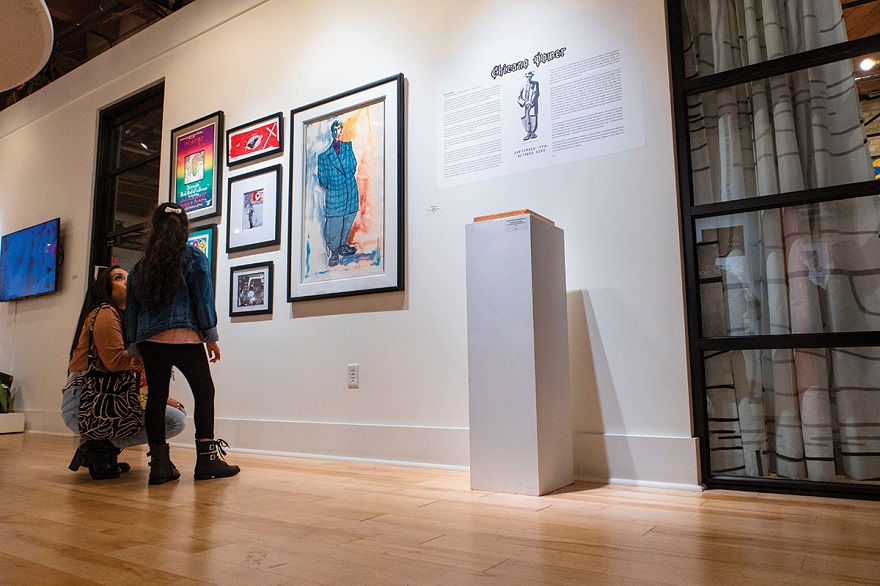 Patrons enjoying the Chicano Power exhibit at the MARN ART + CULTURE HUB in Milwaukee. Pictured works by: José Montoya, Thomas Romero. Media courtesy of the Milwaukee Artist Resource Network