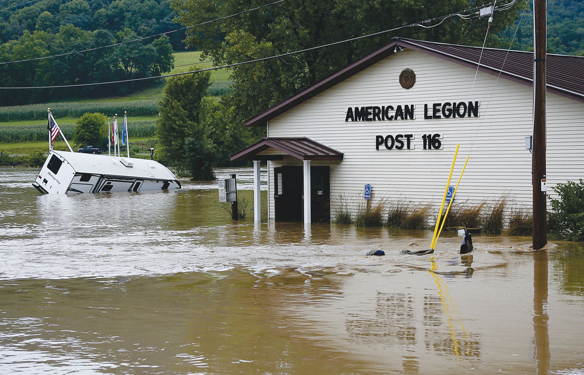 The Coon Valley American Legion Post 116 Building received four feet of water inside. The force of the water opened the locked doors at both ends of the building, and most of the chairs inside floated downstream. Most of the historical artifacts—CV Legion History Books, photos, uniforms, and awards—were preserved. Photo by Jon Lee. 
