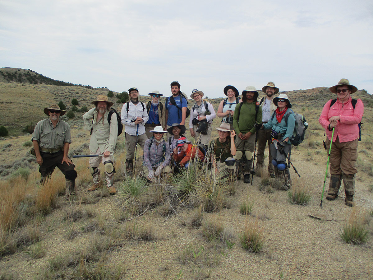 Thomas Carr (second from left) and Matthew Lee (third from left) with faculty and students from MIAD and Carthage College at the Croc and Gar microvertebrate site in Montana, July 2021. The survey takes place on public lands with permission of the Bureau of Land Management. Photo by Megan Seitz