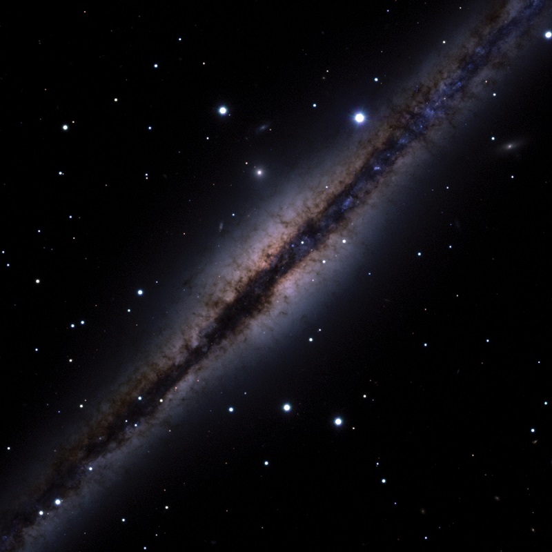 edge-on view of the spiral galaxy known as NGC 891. Photo by J.C. Howk (Notre Dame), B. Savage (Wisconsin), N.A. Sharp (NSF) / WIYN / NOIRLAB / NSF