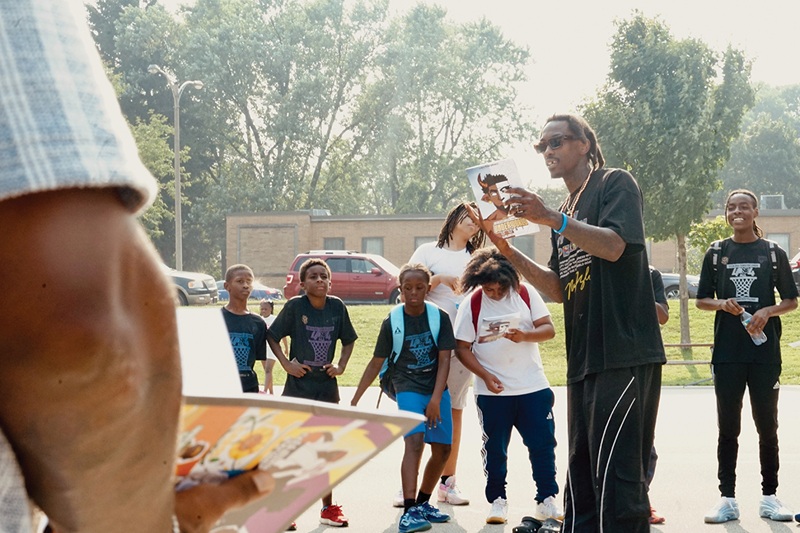 Taylor distributed his wordless comic book to attendees on the final day of the summer league this year. Taylor distributed his wordless comic book to attendees on the final day of the summer league this year.