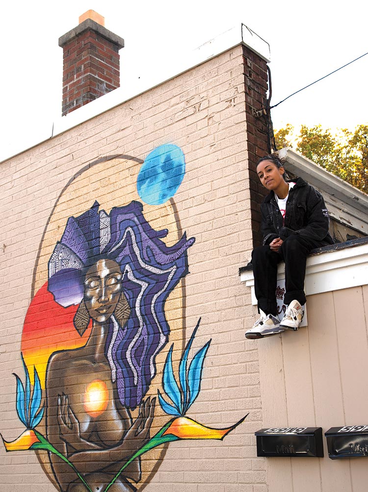 Aisha Valentin and her mural entitled Africa, Milwaukee