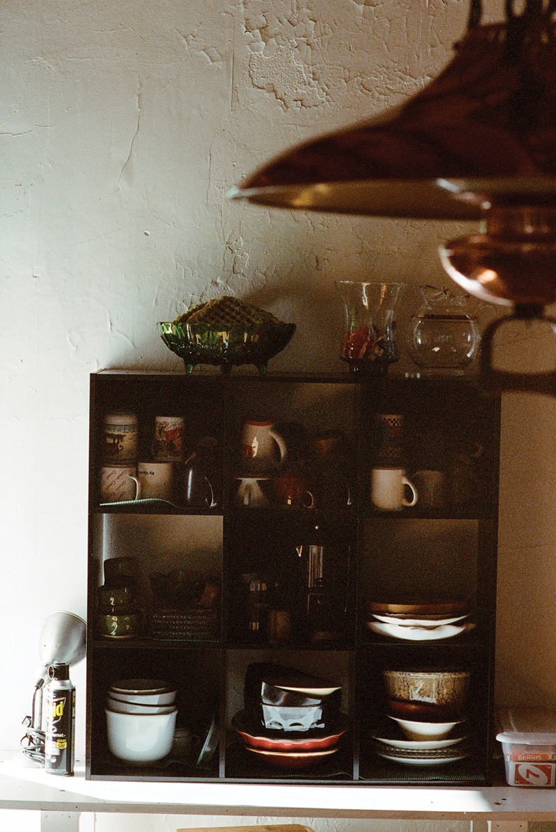 Shelves holding ceramics inside Poor Farm Experiment