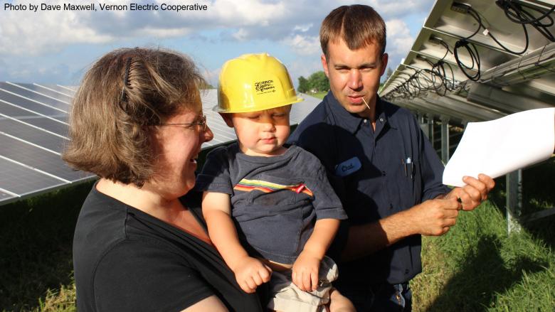 Family purchasing a share in the Vernon Electric Cooperative solar farm. Photo by Dave Maxwell.