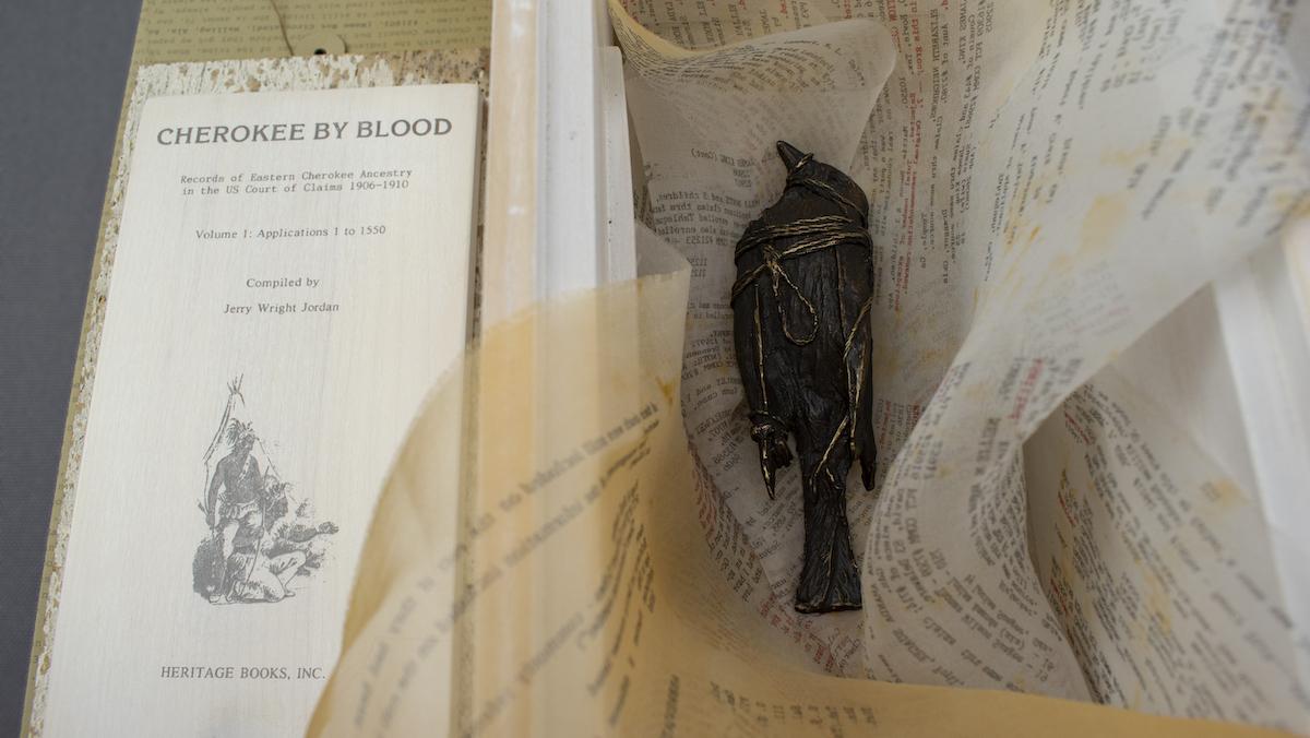 Emily Arthur, Final Determinations: Cherokee by Blood, 2017-2021. Varied edition of 10 artist books with 10 unique lost wax casts of birds. Ash wood, screenprint, procion dye, silk organza, and bronze. Dimensions variable.