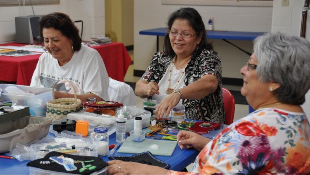 Beaders (l to r) Sandra Gauthier, Judith Jourdan, and Betty Willems at an Oneida Nation Arts Program workshop in 2013. Learn more about Oneida raised beadwork. Photo by Anne Pryor.