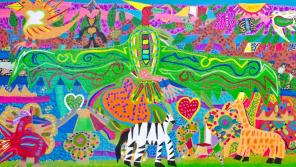Colorful painting of large eagle with wings spanned across center, zebra, birds, and hearts against abstract landscape