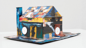 M. Winston, used with permission from Portrait Society Gallery, Untitled (Oatmeal Box House), 2022. Acrylic paint, paper, beads, collaged food boxes, and cardboard. 4x7.5x6 inches.