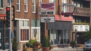 A sign reading “Welcome Poets” hangs outside Scottie’s Eat Mor diner on Main Street in Fort Atkinson, Wisconsin. Former Wisconsin poet laureate Nicholas Gulig saw this sign when he first drove into Fort Atkinson in the summer of 2016. Photo by Colin Crowley / PBS Wisconsin